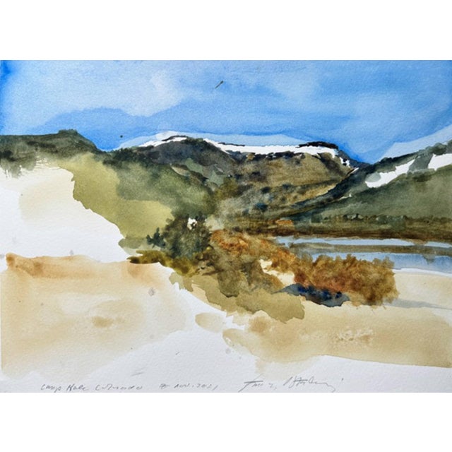 This watercolor depicts a serene landscape of Camp Hale, Colorado, showcasing rolling hills adorned with patches of...