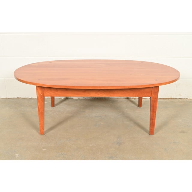 A gorgeous Arts and Crafts or Shaker style solid cherry wood coffee table or cocktail table By Harden Furniture USA, Circa...