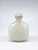 A finely carved Chinese white jade snuff bottle, distinguished by its beautifully understated form and soft, luminous...