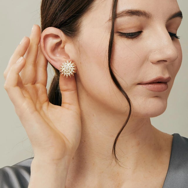 Created in 18 karat yellow gold Mother of pearl 6 carats approx. Diamonds 1.60 carats approx. Post backs for pierced ears...