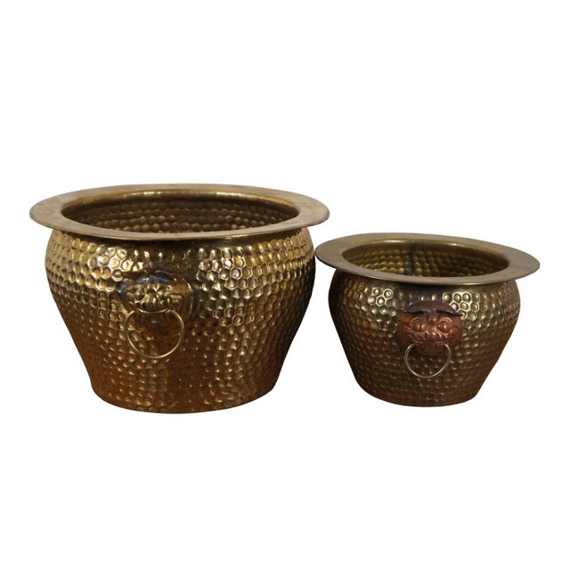 Three vintage Chinese nesting planters / jardinieres / cachepots. Made of brass featuring round form with hammered...