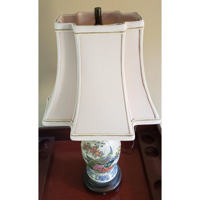 Asian Leviton vase style table lamp with a floral pattern on the front of a cream background. Comes with unusual 'stepped'...