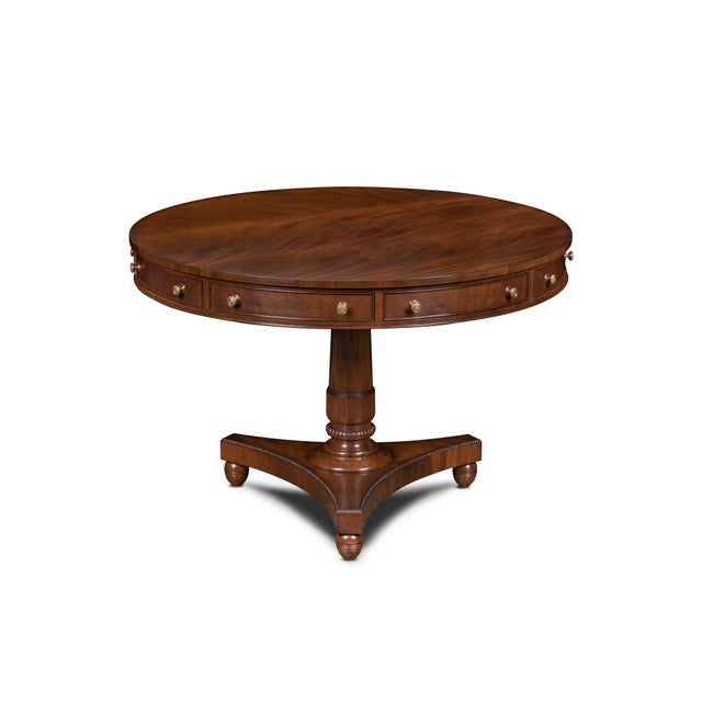 Ingenious design meets timeless craftsmanship in this round pedestal table, where classic form conceals a touch of...