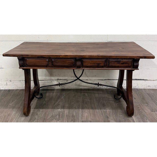 This is a gorgeous and rustic vintage Spanish Colonial style writing desk or library table featuring a solid wood plank...