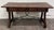 This is a gorgeous and rustic vintage Spanish Colonial style writing desk or library table featuring a solid wood plank...