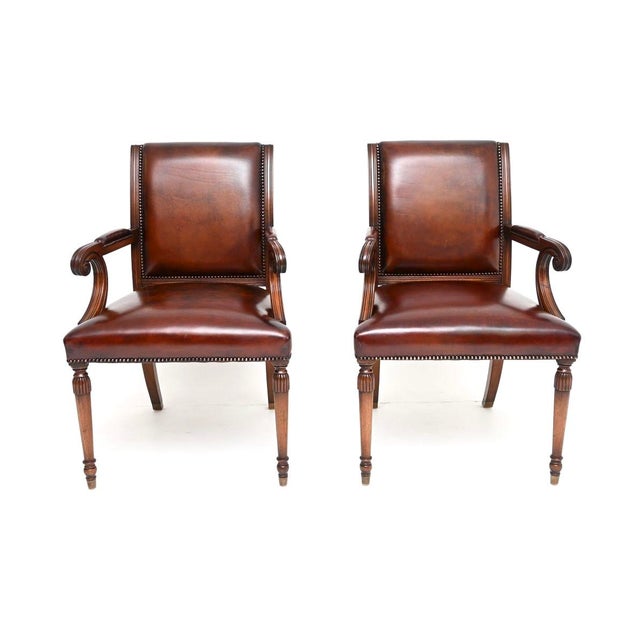 A smart and extremely well made pair of antique Georgian style leather armchairs. They were made in England, they date...