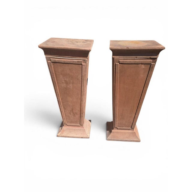 Elegant pair of terracotta pedestals dating from the 1950s, distinguished by their balanced proportions and timeless...