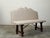 An Italian walnut bench from the 19th century, with turned base, iron stretcher and new upholstery. Created in Italy...