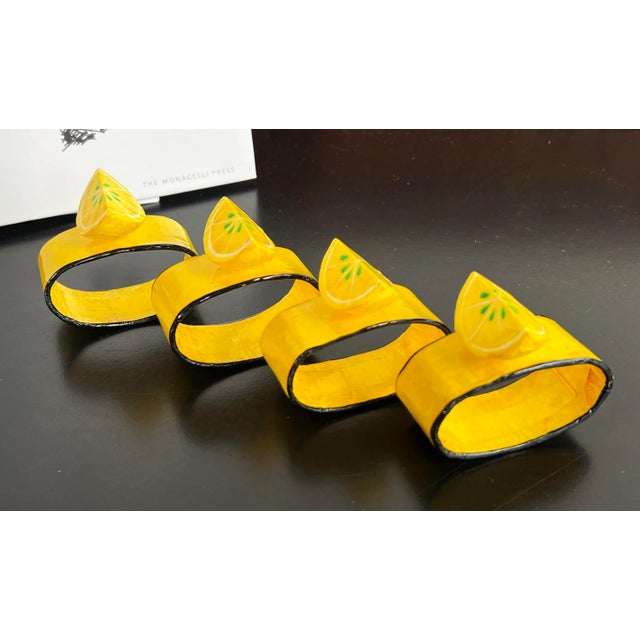 Fabulously fun and whimsical papier mache napkin rings in lemon yellow with small lemon wedges on top! They measure 2 3/4"...