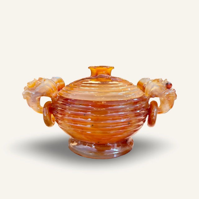19th century carved carnelian or agate lidded vessel with dragon handles encircling carved rings. Dimensions: Overall -...