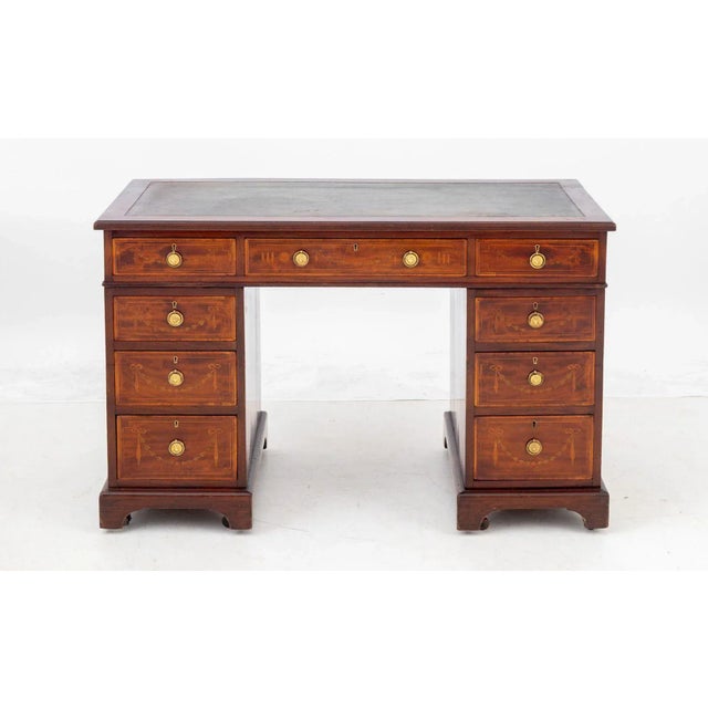 Victorian Mahogany Pedestal Desk, late 19th century, with green leather top have three drawers above two pedestals...