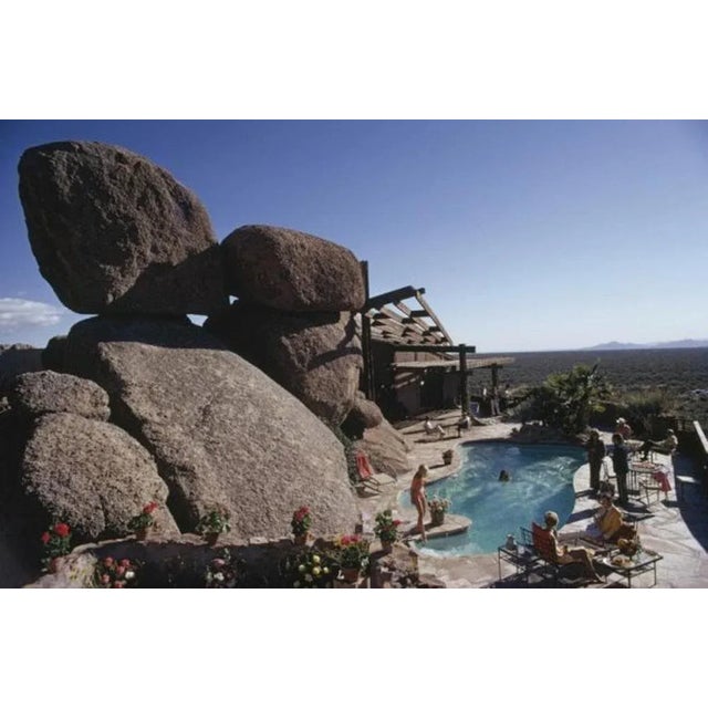 Pool at Bouldereign 1973 by Slim Aarons Slim Aarons Limited Estate Edition Guests round the pool at Bouldereign, Carl...
