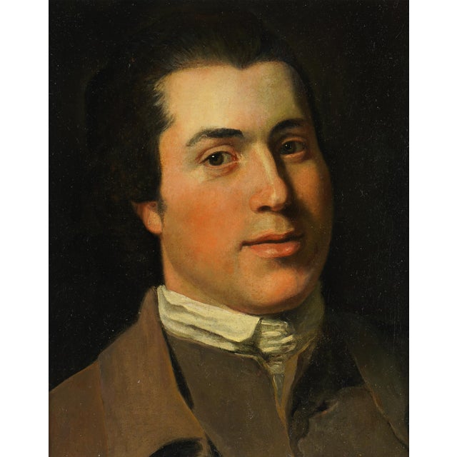 An English oil on canvas portrait of a gentleman, painted around 1780-1800, gives its unnamed sitter an unusually warm,...
