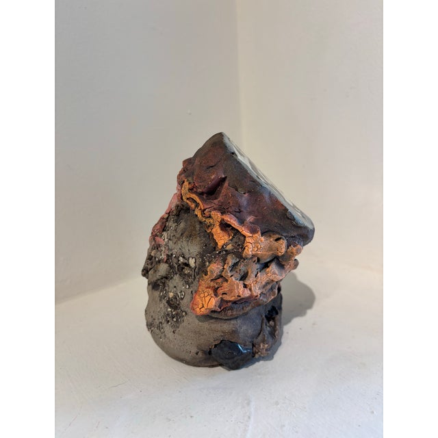 Lynn Basa Sliced Geode with orange lichen ceramic 6.5 x 5 x 5 I have a recurring fantasy that, while fossil hunting, I...