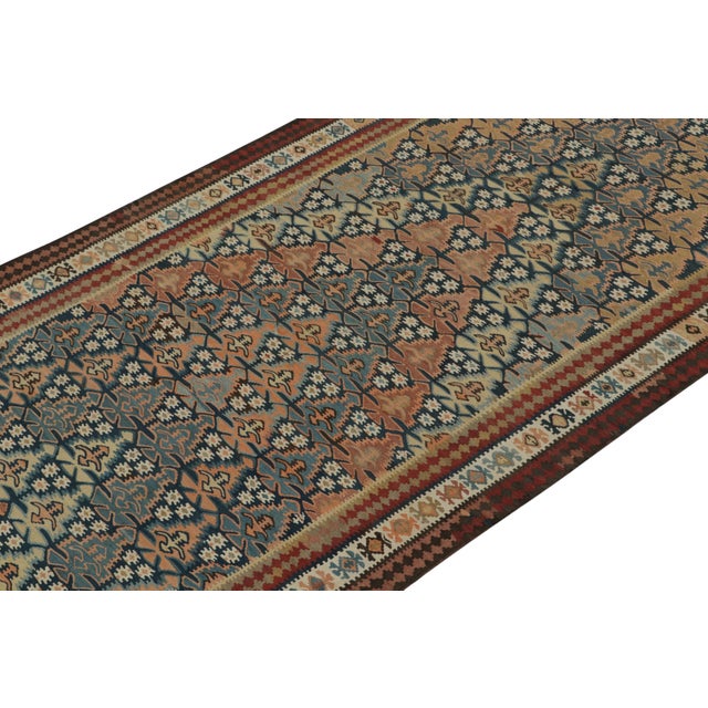 This vintage 5x17 Persian kilim is a unique tribal rug for its period, handwoven in wool circa 1950-1960. Further on the...