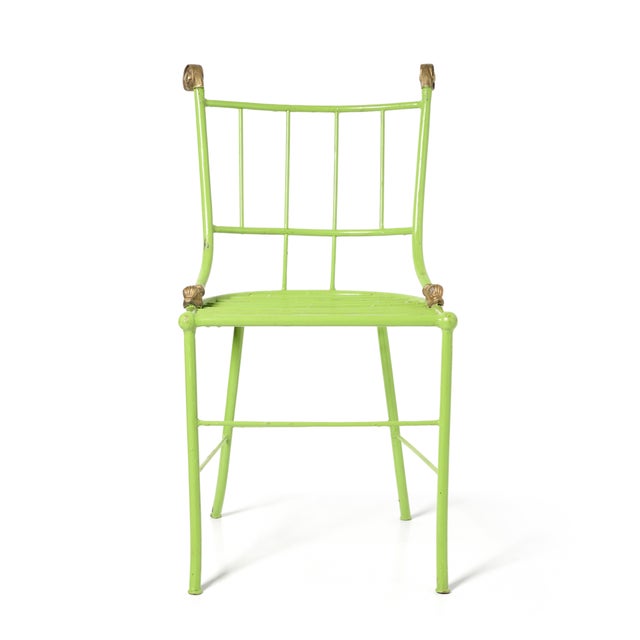 Set of 4 Iron 1930s chairs decorated with gilt scrolls and dolphin details and bright green enamel original paint. 4...