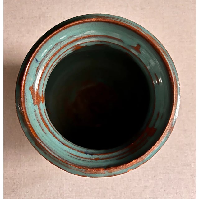 Multicolored ceramic vase. Top light blue neck. Natural gray body with multi-colored strokes of colors. Purchased at an...