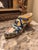 Unusual antique shoe form with raised laces and hand paint decorated surfaces with heavy glaze.