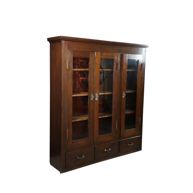 Antique Mission / Arts & Crafts / Limbert style triple bookcase display cabinet. Made of oak featuring three glass doors...
