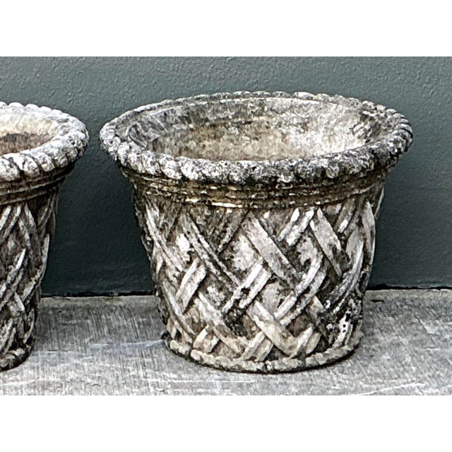 Enhance your landscape with this exceptional pair of vintage cast concrete planters, designed with a sophisticated trellis...