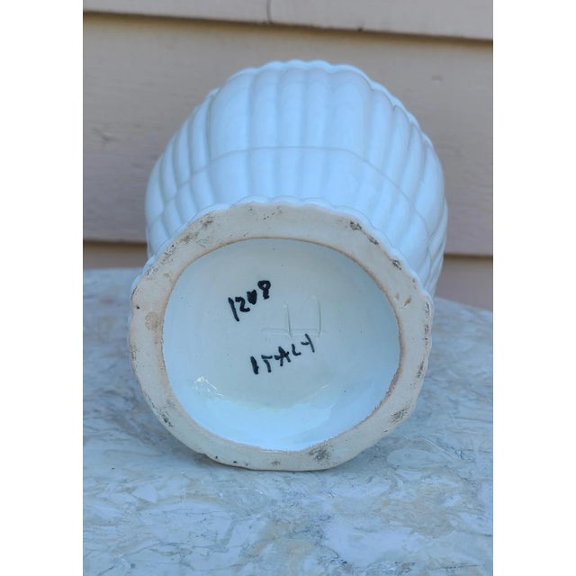 In a classic urn form without handles, here is a hand-made ceramic vase from Italy. Simple vertical undulating lines and...