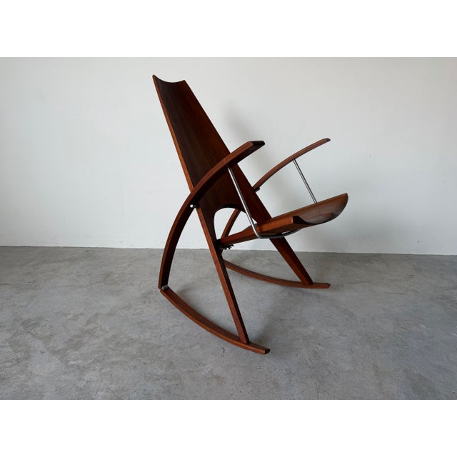 An exceptional 1973 studio-crafted rocking chair by California designer Leon Meyer, showcasing a striking sculptural...