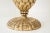 A pair of gold leaf composition lamps in a pineapple shaped design. Height is 19 inches from the base to the top of the...