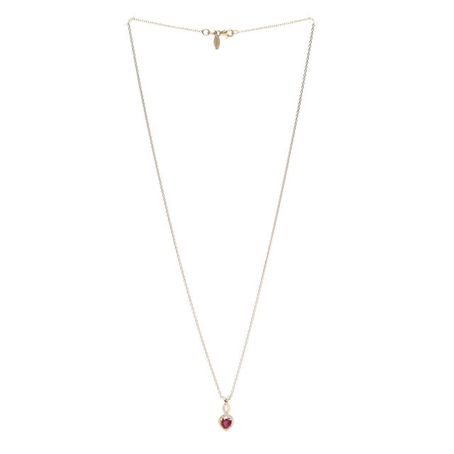 Stones: ruby, 1 heart cut 4.9 mm approximately .55 total carats diamond, 21 round brilliant cut .8 - .9 mm approximately...