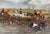 Charming sporting oil painting on wood panel depicting a lively English fox hunt or steeplechase. A field of mounted...