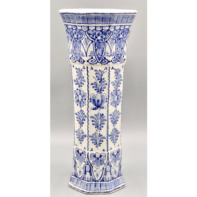 Fine quality Mid Century traditional Delft vase manufactured by De Delftse Pauw. It is an octagonal, hand painted faience...