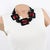 This lovely Angela Caputi, made in Italy, resin necklace works on black and burgundy-red contrast. The choker features...