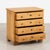 Early 20th century Danish small chest of four drawers, crafted in pine with a natural wax finish that brings out the...