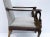 It is a 19th century Italian neo-classical style carved walnut swan form bergere chair. The gilding is worn and enhances...