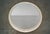 Large 1980's vintage Art Deco mirror for sale. It has a fiberglass frame in an ivory white lacquer with a brass inlay....