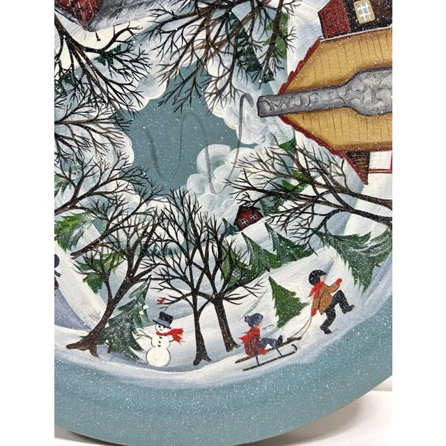 One-of-a-kind hand-painted folk art turntable or lazy Susan featuring a panoramic snowy village scene wrapped around the...