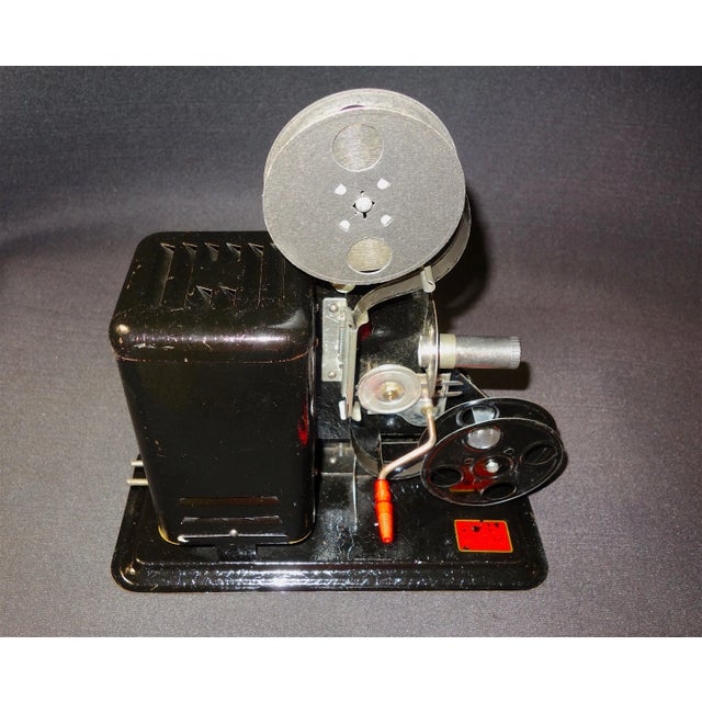 This recently discovered, American made, 16mm hand crank projector has original, very well patinated 1920's black paint...