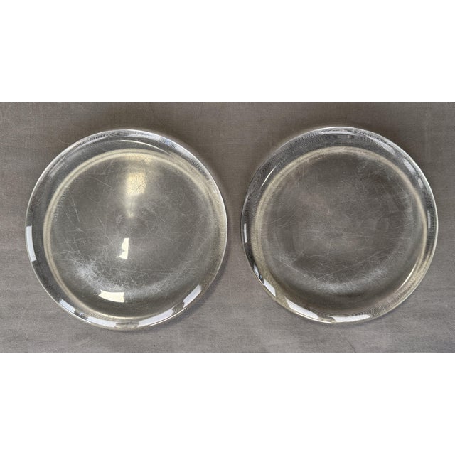 Two hand-signed plates by Salviati for Charles Pfister, Murano. Glass, each measuring 2.6 x 20.4 cm. Scratches on the...