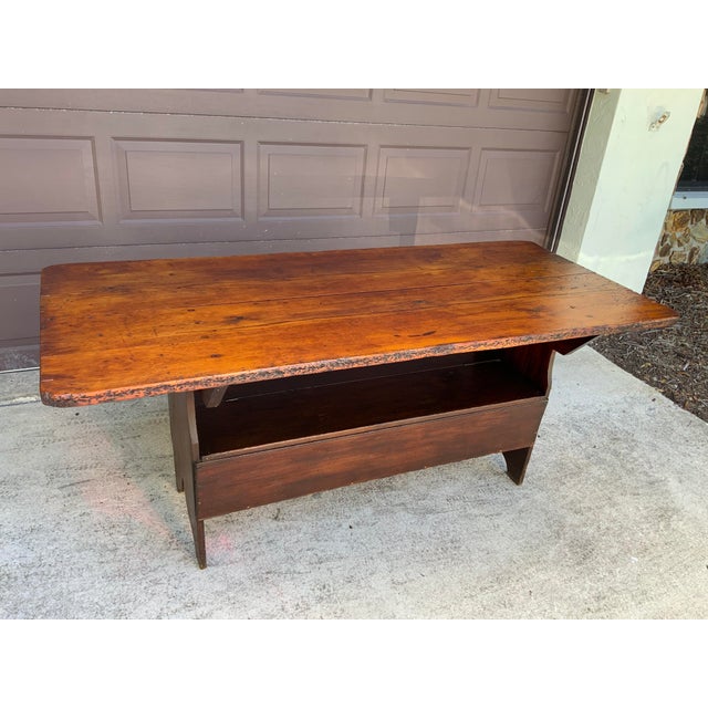Late 19th / early 20th century Hutch table with a two board Pine top and Pine and Poplar base. The breadboard end storage...