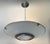 Italian modern pendant chandelier with sanded textured glass panel and central frosted faceted glass diffuser mounted on...