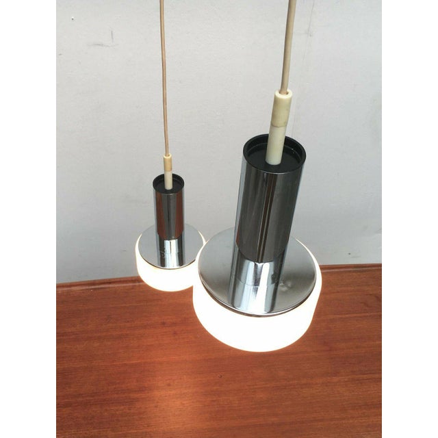 Mid century pendant from the well-known manufacturer Staff Leuchten, Germany. Simple shape, which is also made up of...