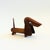 A mid century turned wood figurine in the shape of a Dachshund. Adorable stylized features with suede ears. Made in Japan...