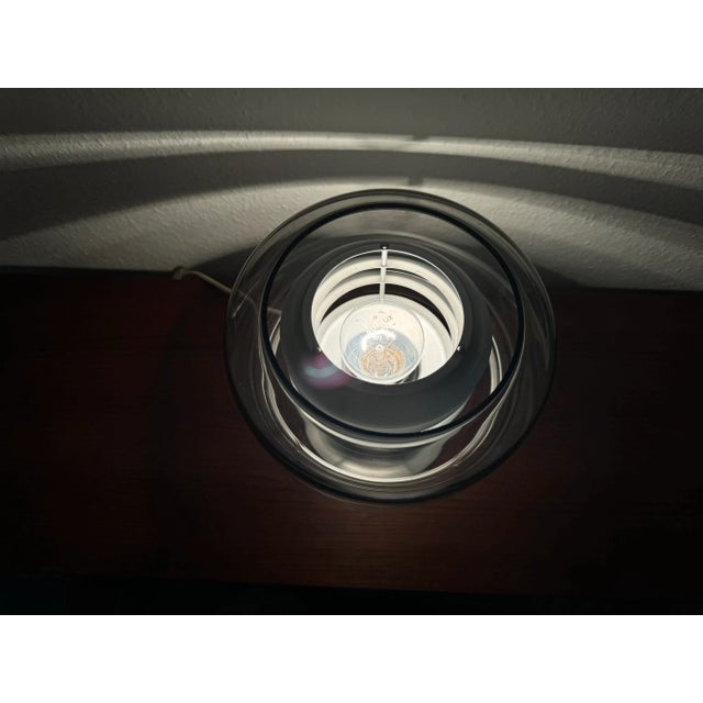 70s table lamp with smoked glass lampshade & brushed aluminum frame. The lamp is in excellent condition, both technically...