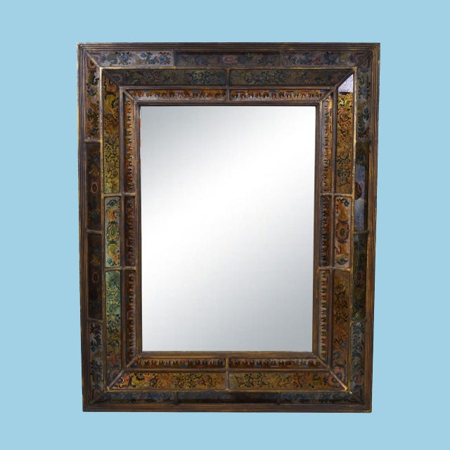 A pair of vintage mirrors with wide frames of hand-painted floral panels in rich, exotic tones — a true old-world...