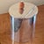 A chic little Edwardian tea caddy, oval with a rope twist border around he top and an unusual partly hinged lid with a...