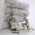 A captivating narrative pair for a curated collection, this vintage solid silver ensemble brings the timeless romance of...