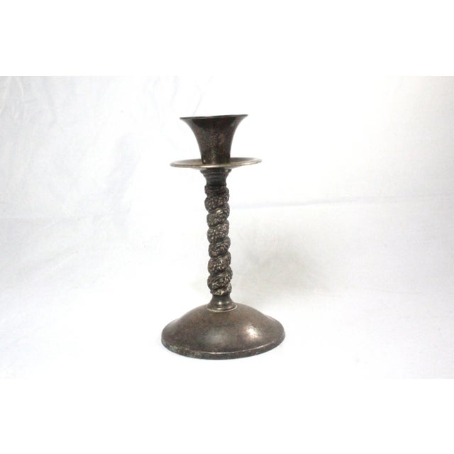 Candlestick holder. measures 5.5" tall with a base width of 3" Candle holder is in good vintage condition. There are no...