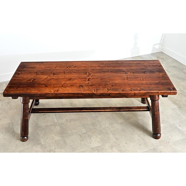 A vintage French pine dining table from circa 1960, that blends the artisanal spirit of the mid-century Brutalist movement...