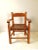 This vintage handmade child’s wood armchair features a beautifully contoured slat seat paired with thick, hand-turned...