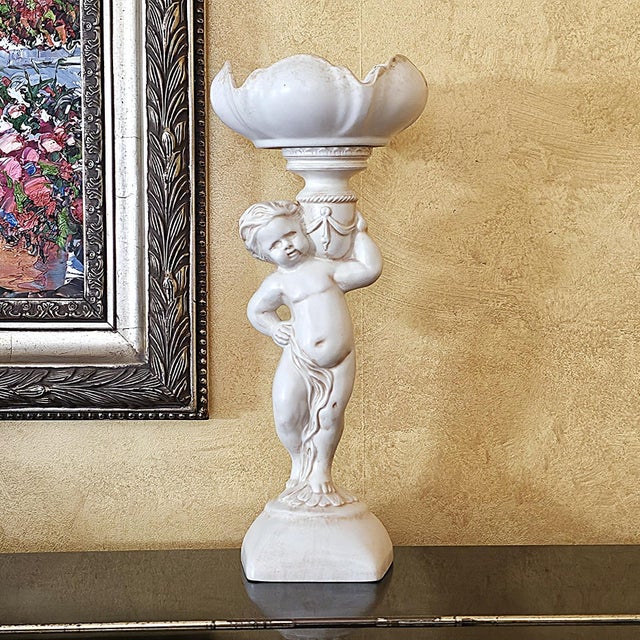 Charming vintage Arnel’s ceramic cherub compote bowl made in Canby, Oregon during the 1960s. This sculptural piece...