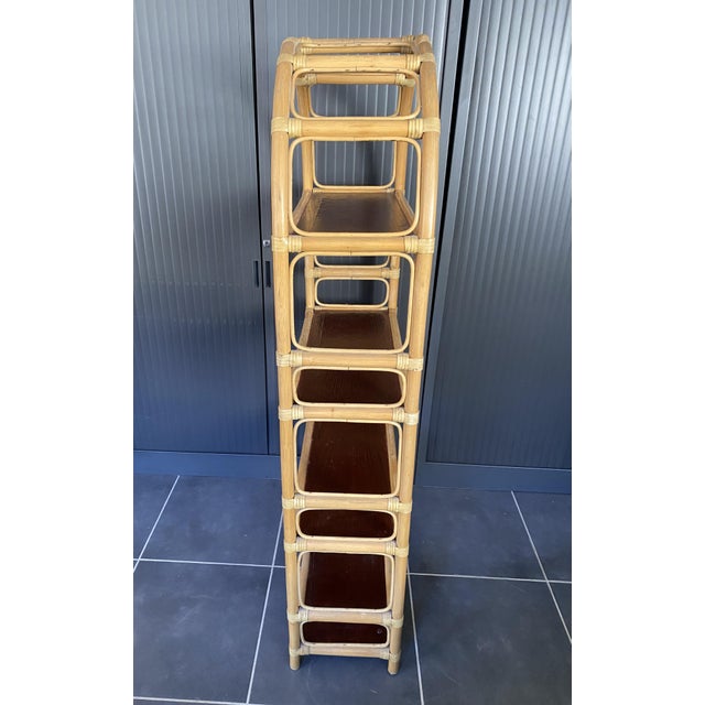 Beautiful 4-tier rattan bookcase Sturdy leather ties Dimensions: Height 155cm Width 70cm Depth 30cm Height between shelves...
